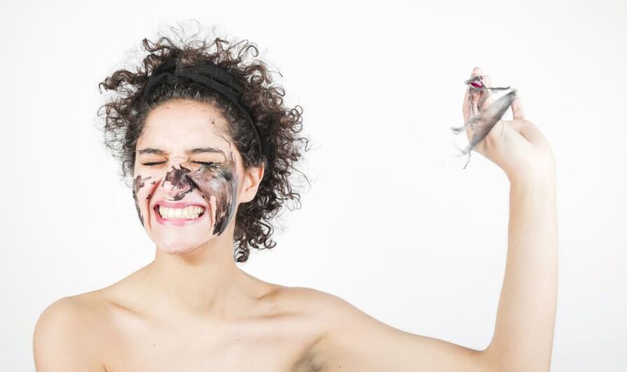 the woman performs a rejuvenating facial skin treatment